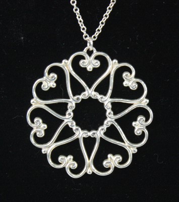 Lot 2584 - A Tiffany & Co silver multi-heart pendant...