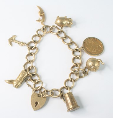 Lot 2590 - A 9ct gold curblink charm bracelet, with heart...