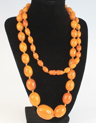 Lot 2592 - A butterscotch amber knotted necklace,...