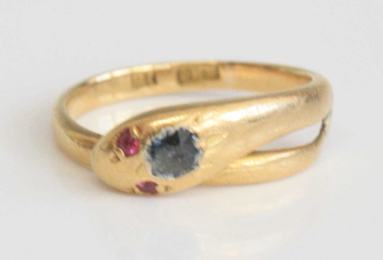 Lot 2616 - A late Victorian yellow metal snake ring, set...