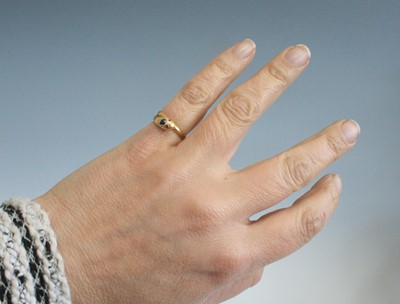 Lot 2616 - A late Victorian yellow metal snake ring, set...