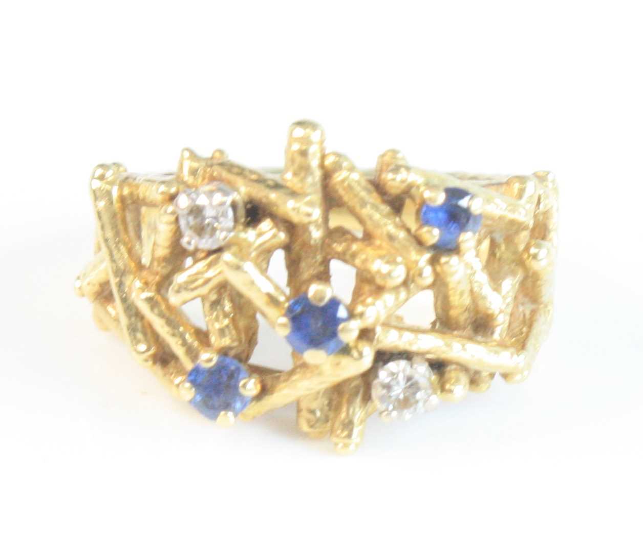 Lot 108 - An 18ct yellow gold, sapphire and diamond...