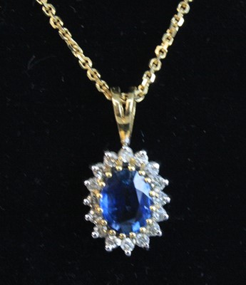 Lot 2623 - An 18ct yellow gold, sapphire and diamond oval...