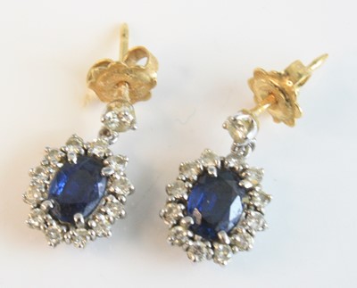 Lot 2624 - A pair of yellow and white gold, sapphire and...