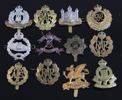 Lot 569 - A collection of cap badges, to include...