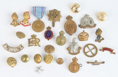 Lot 569 - A collection of cap badges, to include...