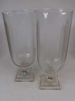 Lot 25 - A pair of modern glass storm lamps, each...