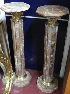 Lot 1141 - A pair of contemporary variegated rouge marble...