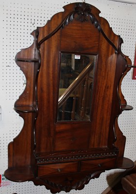 Lot 1146 - A late 19th century mahogany wall shelf, of...