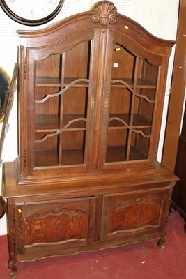 Lot 1157 - A Belgian oak side cabinet, having arched twin...