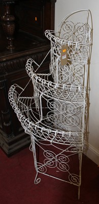 Lot 1200 - A Victorian white painted wirework three-tier...