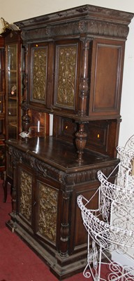 Lot 1201 - A circa 1900 Continental relief carved walnut...
