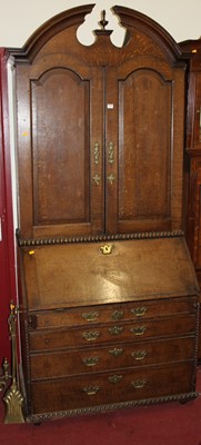 Lot 1204 - A 19th century provincial oak bureau cabinet,...