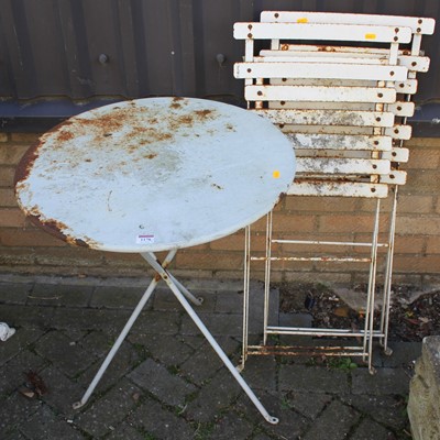 Lot 1178 - A painted metal circular folding patio table,...