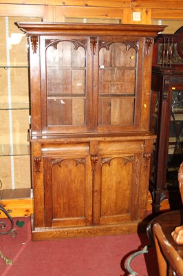Lot 1210 - A mid-Victorian oak Gothic Revival bookcase...