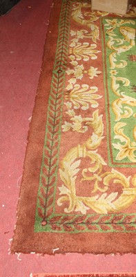 Lot 1187 - A green and red ground Stockwell carpet,...