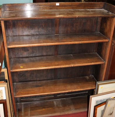 Lot 1218 - A 1930s oak freestanding open bookshelf, with...
