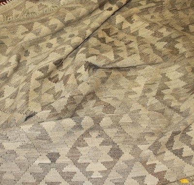 Lot 1194 - A Turkish Kelim woollen pale ground rug with...