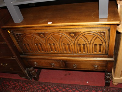 Lot 1235 - A contemporary moulded oak hinge top mule...