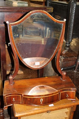 Lot 1241 - A Regency mahogany shield shaped swing box...