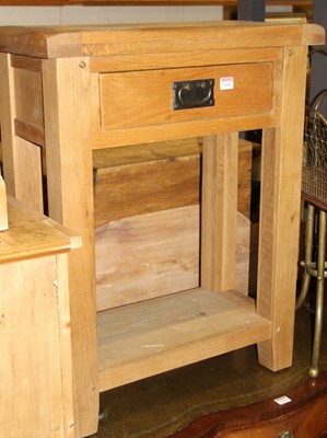 Lot 1242 - A contemporary light oak single drawer...