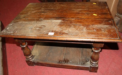 Lot 1253 - A joined oak low two-tier occasional table on...
