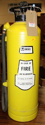 Lot 1266 - A yellow painted cast metal fire extinguisher,...