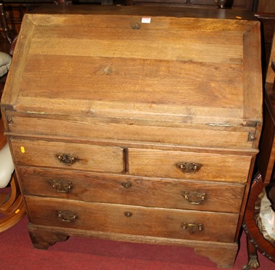 Lot 1270 - A 19th century provincial oak slope front...