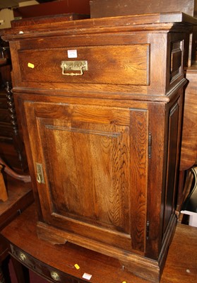 Lot 1276 - A contemporary panelled oak single door low...