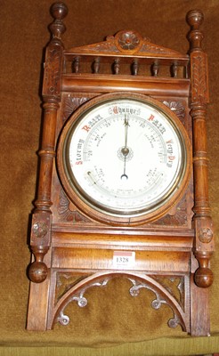 Lot 1328 - A late Victorian oak aneroid barometer
