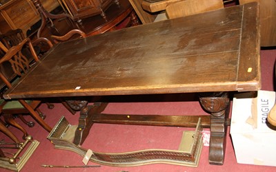 Lot 1331 - A joined oak plank topped refectory dining...