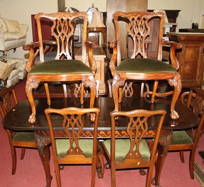 Lot 1334 - A mahogany round cornered extending dining...