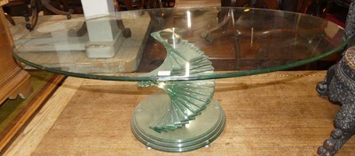 Lot 1341 - A contemporary heavy glass oval topped coffee...