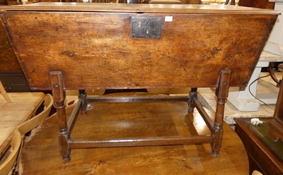 Lot 1349 - An 18th century provincial elm hinge topped...