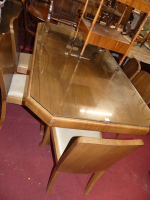 Lot 1366 - An Art Deco figured walnut dining suite,...