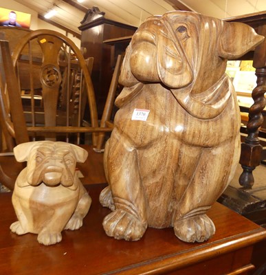 Lot 1370 - A contemporary carved teak model of a seated...