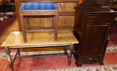 Lot 1372 - An oak low rectangular coffee table, on spiral...