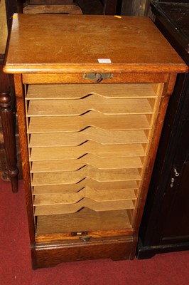 Lot 1298 - An early 20th century oak tambour fronted...