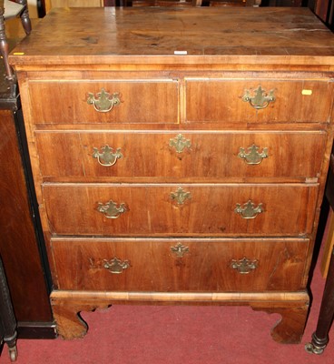 Lot 1301 - An 18th century walnut chest of two short over...