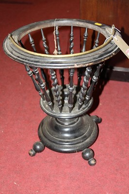 Lot 1303 - A 19th century ebonised plant stand, having...