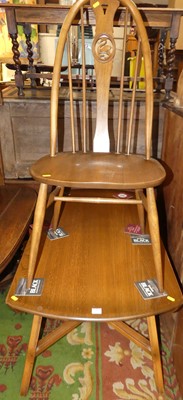 Lot 1380 - An Ercol mid-elm dining suite, comprising;...