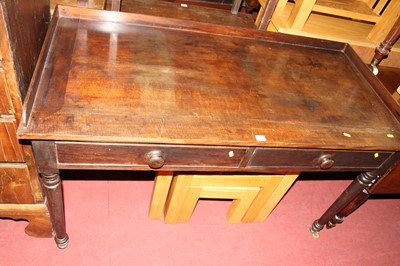 Lot 1305 - A Victorian mahogany two drawer writing table,...