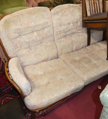 Lot 1385 - An Ercol mid-elm stickback three-seater sofa,...