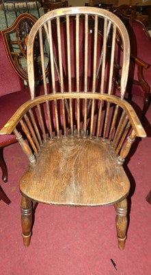 Lot 1394 - An elm and beech stickback Windsor chair, w.57cm