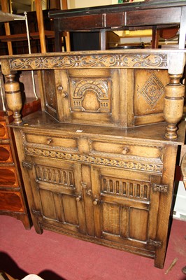 Lot 1314 - A contemporary joined and moulded oak court...