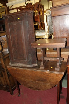 Lot 1315 - An early 19th century provincial oak drop leaf...