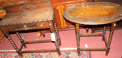 Lot 1322 - A 1920s oak single drawer ledge back barley...