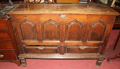 Lot 1419 - An 18th century joined oak four panelled hinge...