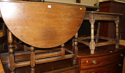 Lot 1429 - A contemporary joined oak dropleaf dining...