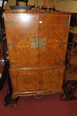 Lot 1433 - A mid-20th century figured walnut four door...